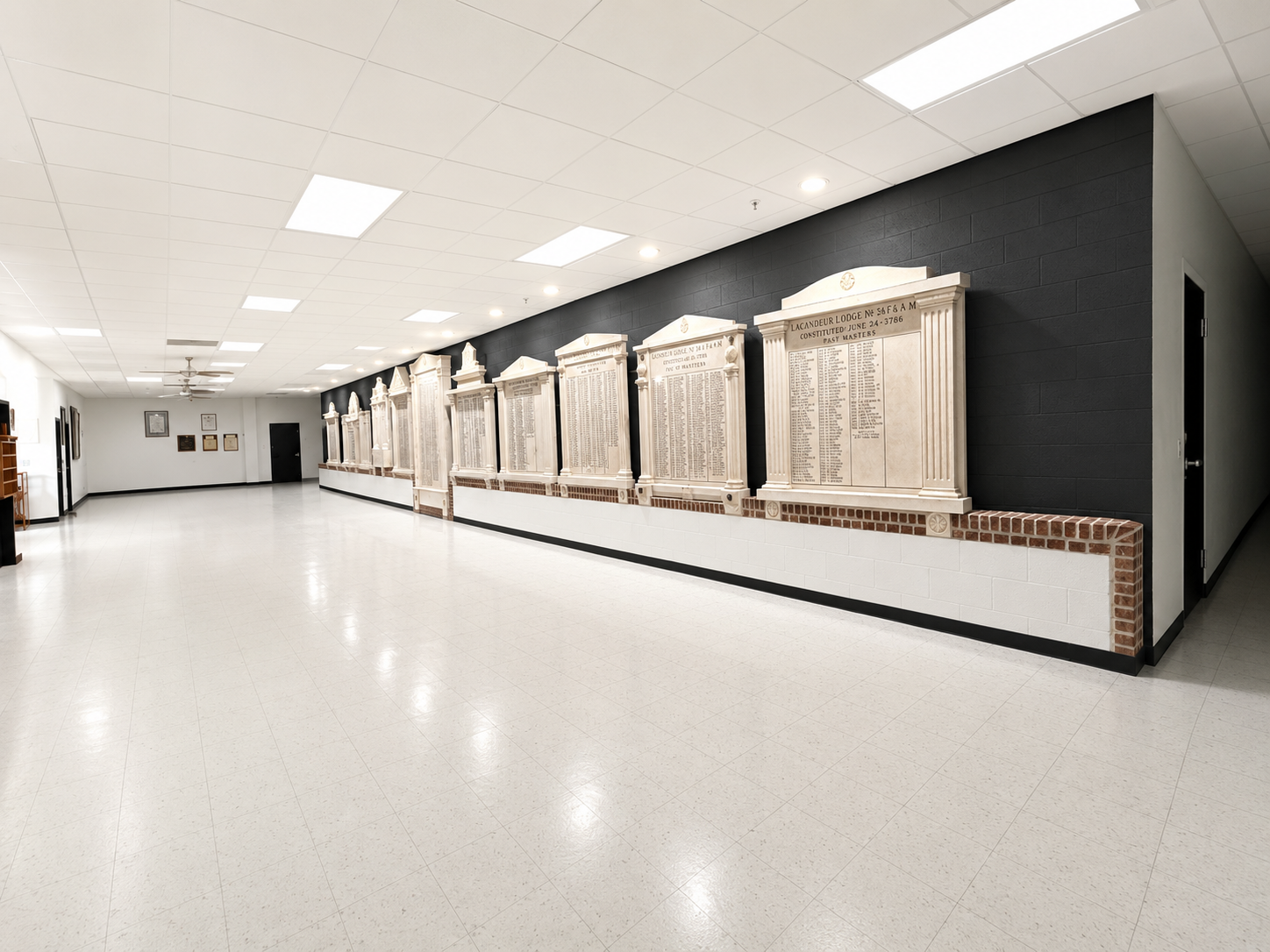 Corridor with Past Masters monuments at The Pillars