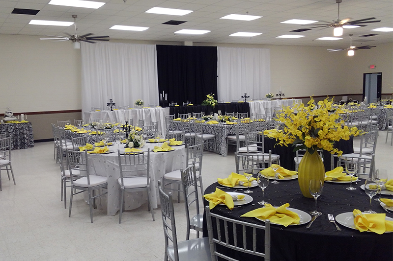 Hall set with silver chiavari chairs and yellow florals